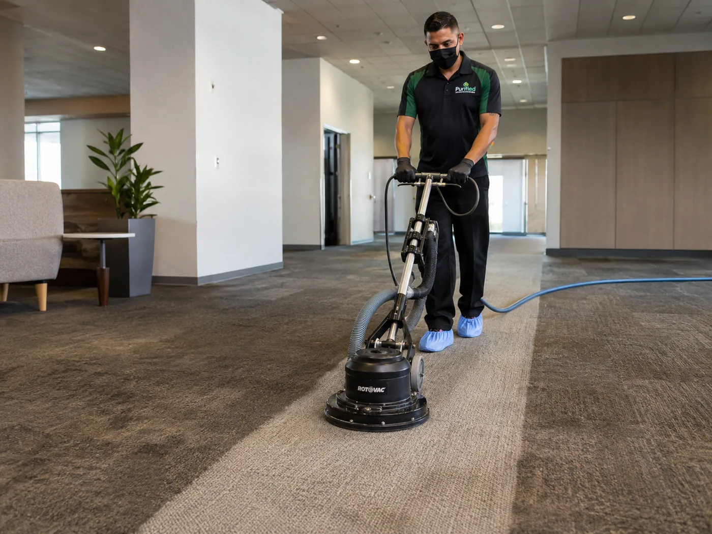 Commercial carpet cleaning with a rotary extractor on a large office carpeted area